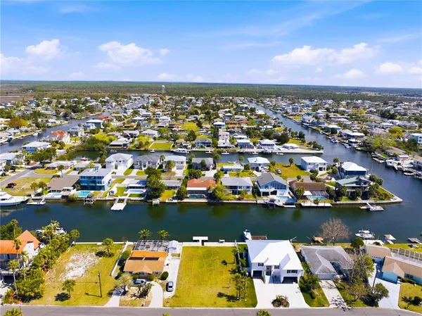 an aerial view of city and lake