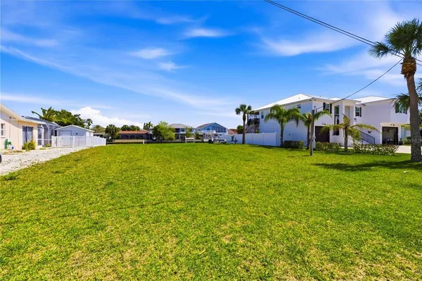 a view of a swimming pool and an outdoor seating
