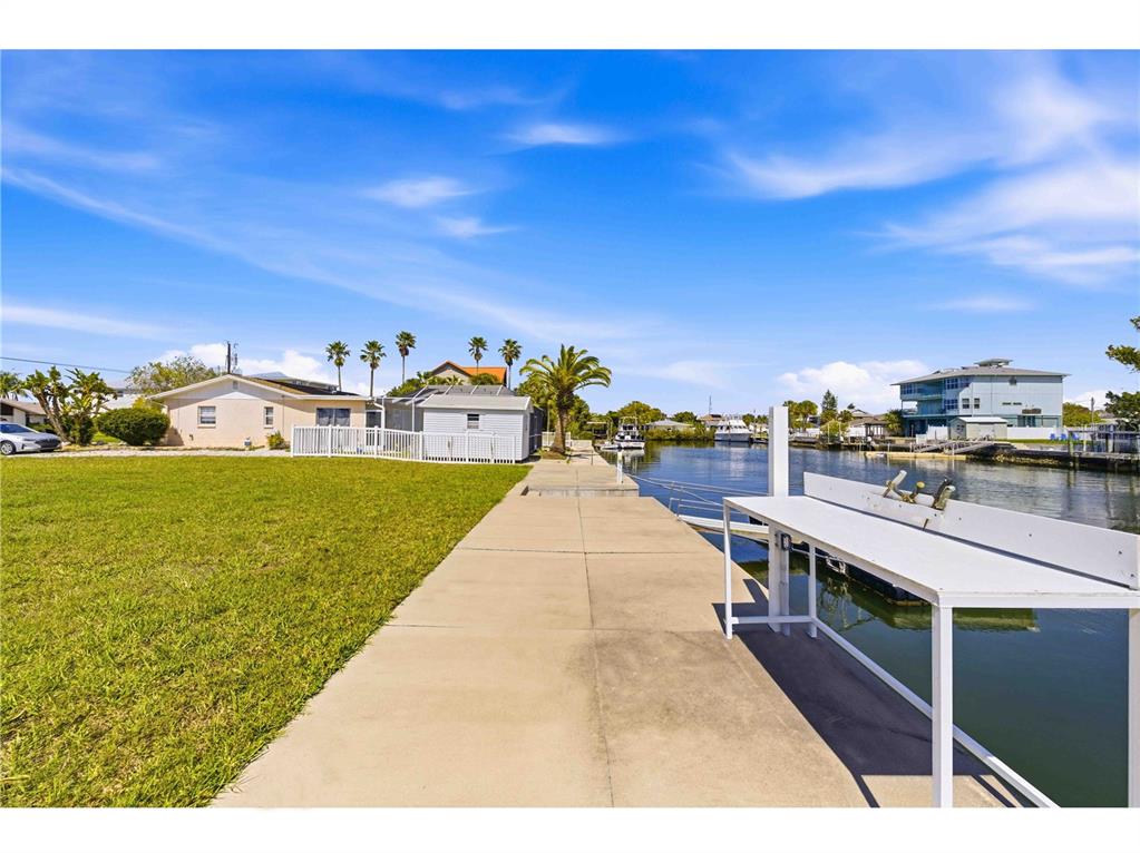 4530 Gulfstream Drive Hernando Beach, FL 34607 - Photo 10 of 16 a view of a swimming pool and an outdoor seating