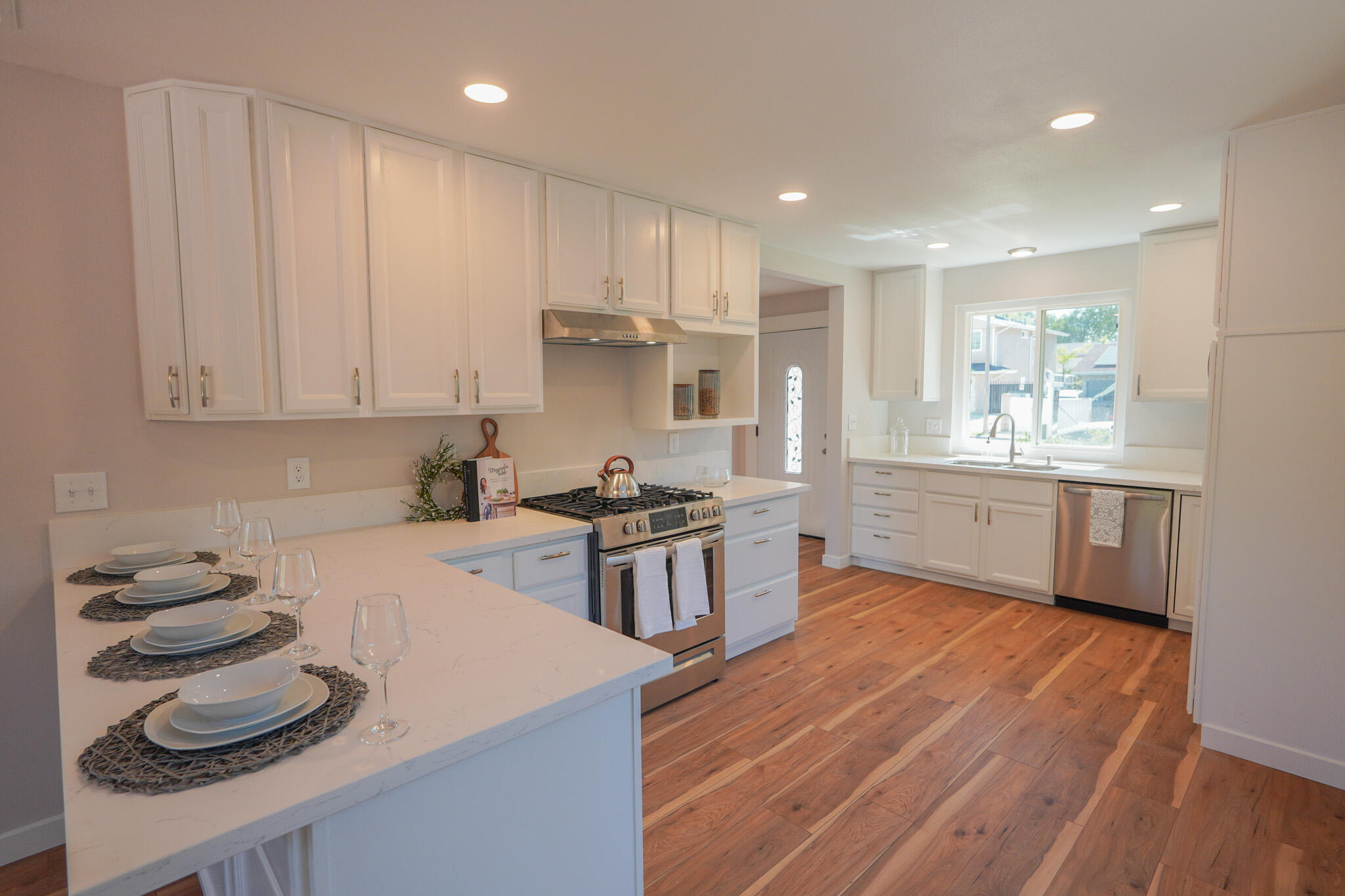 926 Talbert Avenue Simi Valley, CA 93065 - Photo 12 of 40 a kitchen with stainless steel appliances granite countertop a sink stove and refrigerator