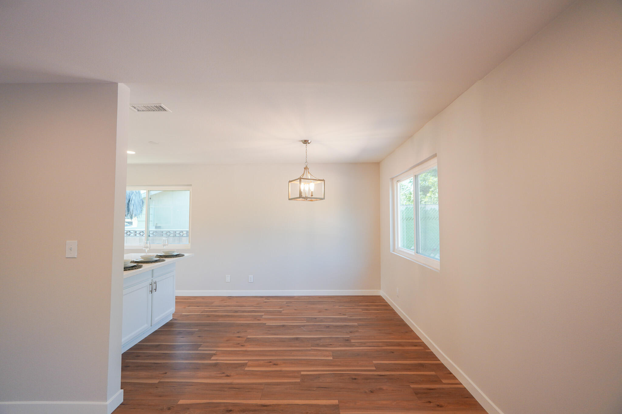 926 Talbert Avenue Simi Valley, CA 93065 - Photo 14 of 40 an empty room with wooden floor and windows