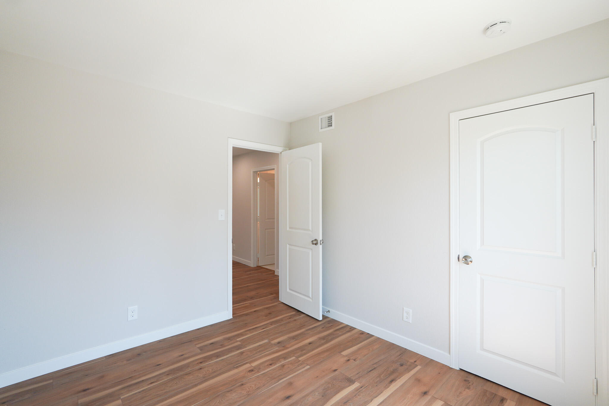 926 Talbert Avenue Simi Valley, CA 93065 - Photo 23 of 40 a view of an empty room with wooden floor
