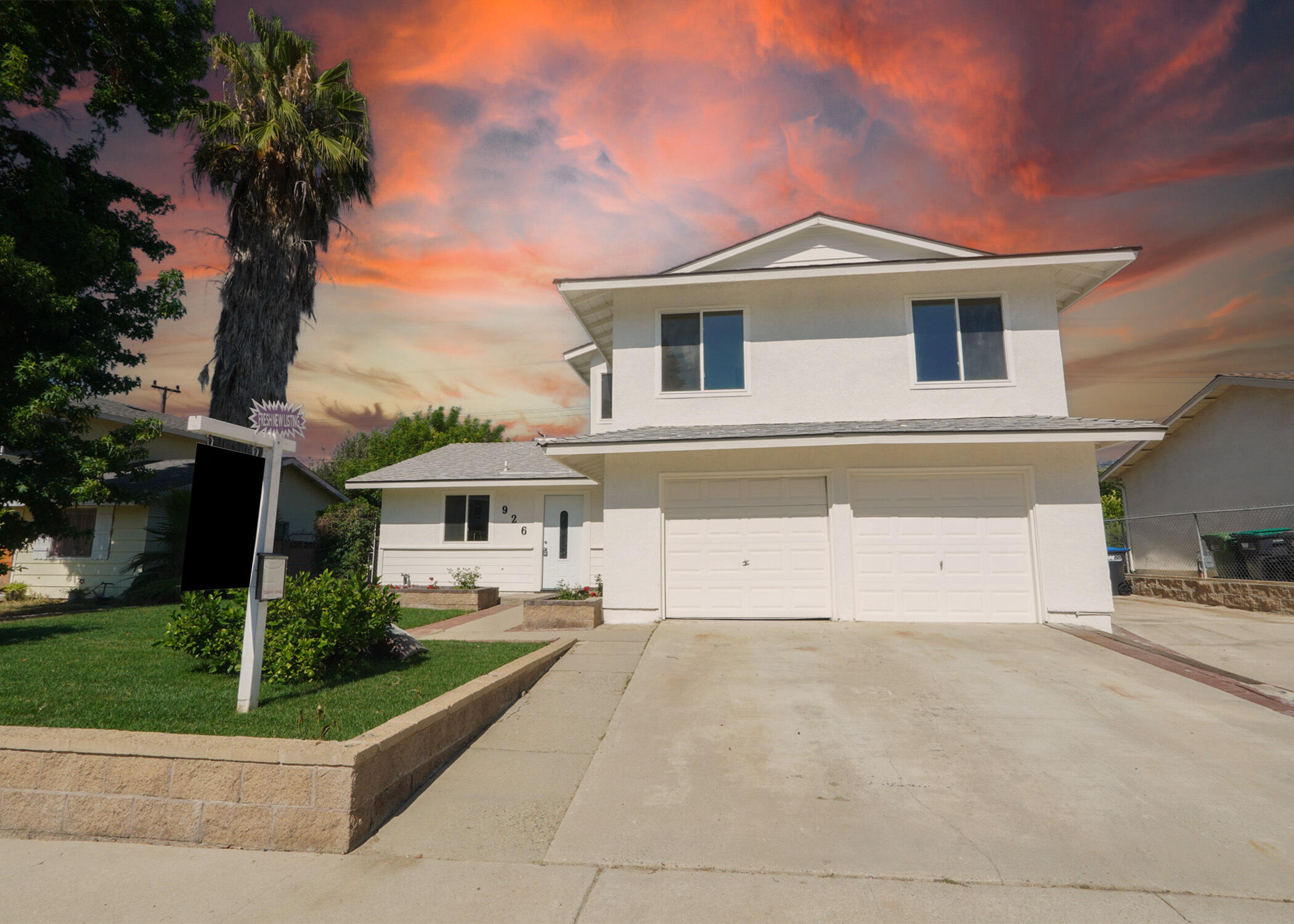 926 Talbert Avenue Simi Valley, CA 93065 - Photo 3 of 40 a front view of a house with a yard and garage