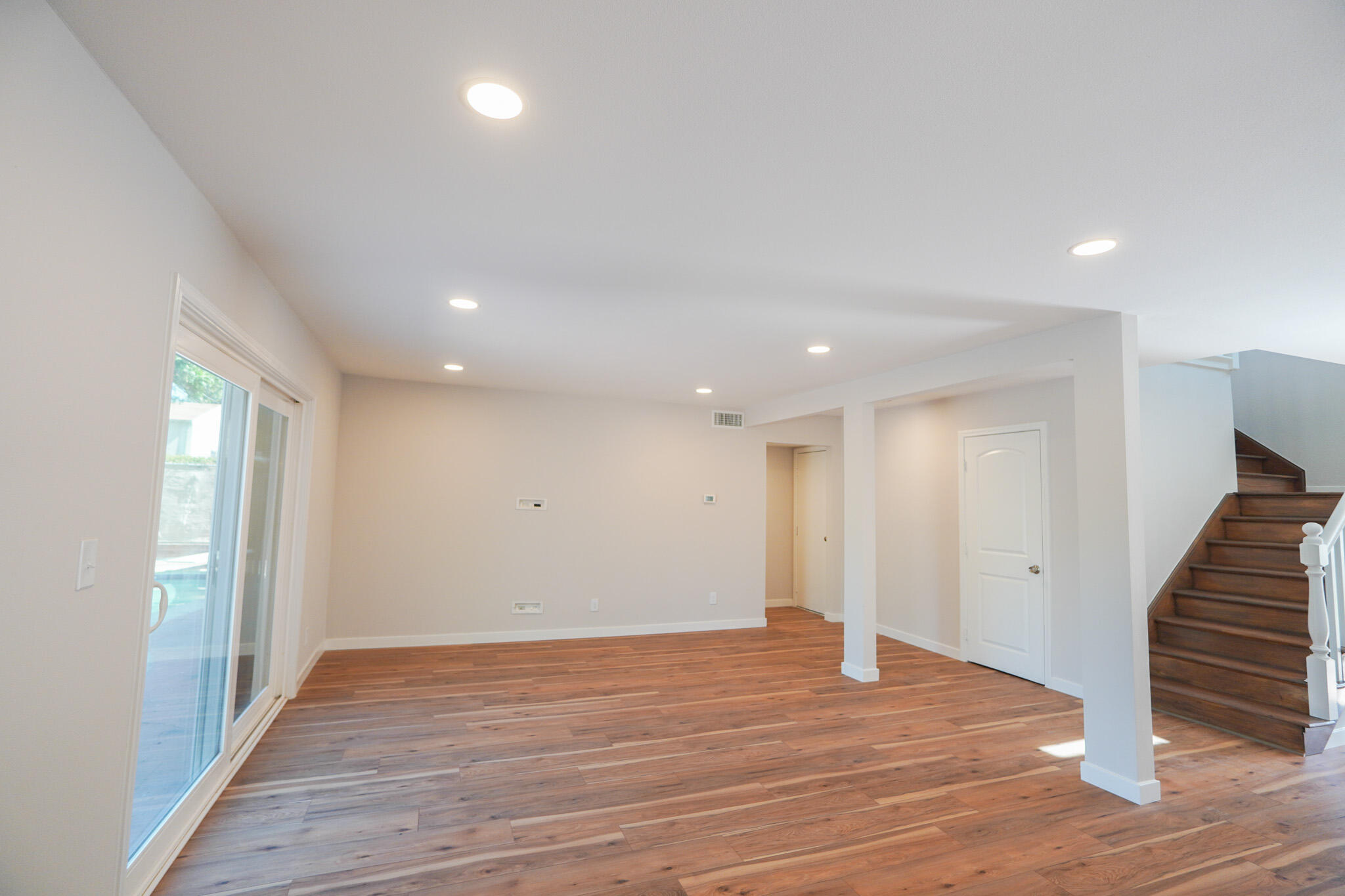 926 Talbert Avenue Simi Valley, CA 93065 - Photo 4 of 40 a view of an empty room with wooden floor and entryway