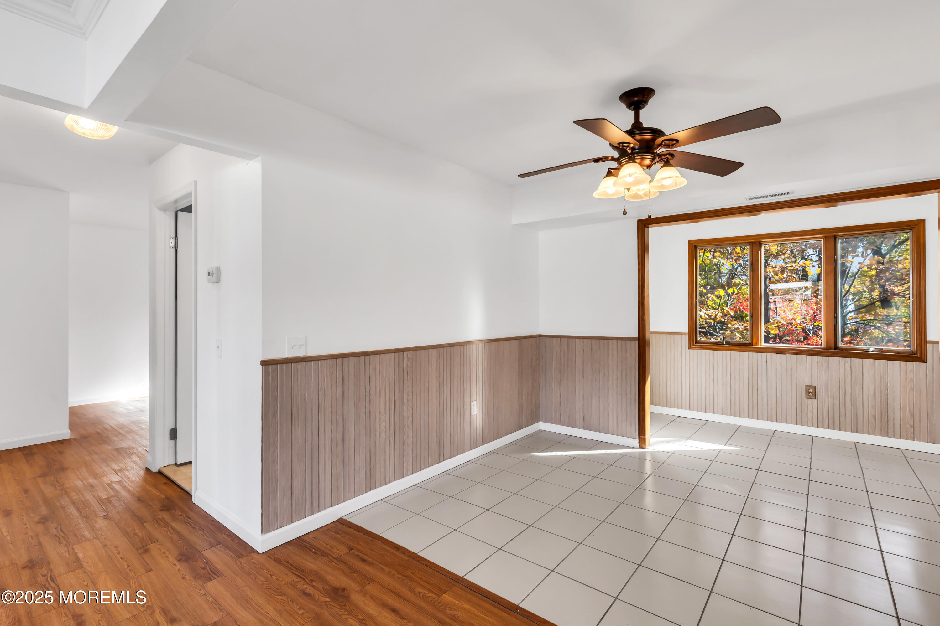 5 Indiana Court, Unit A Matawan, NJ 07747 - Photo 13 of 32 a view of an empty room with window and wooden floor