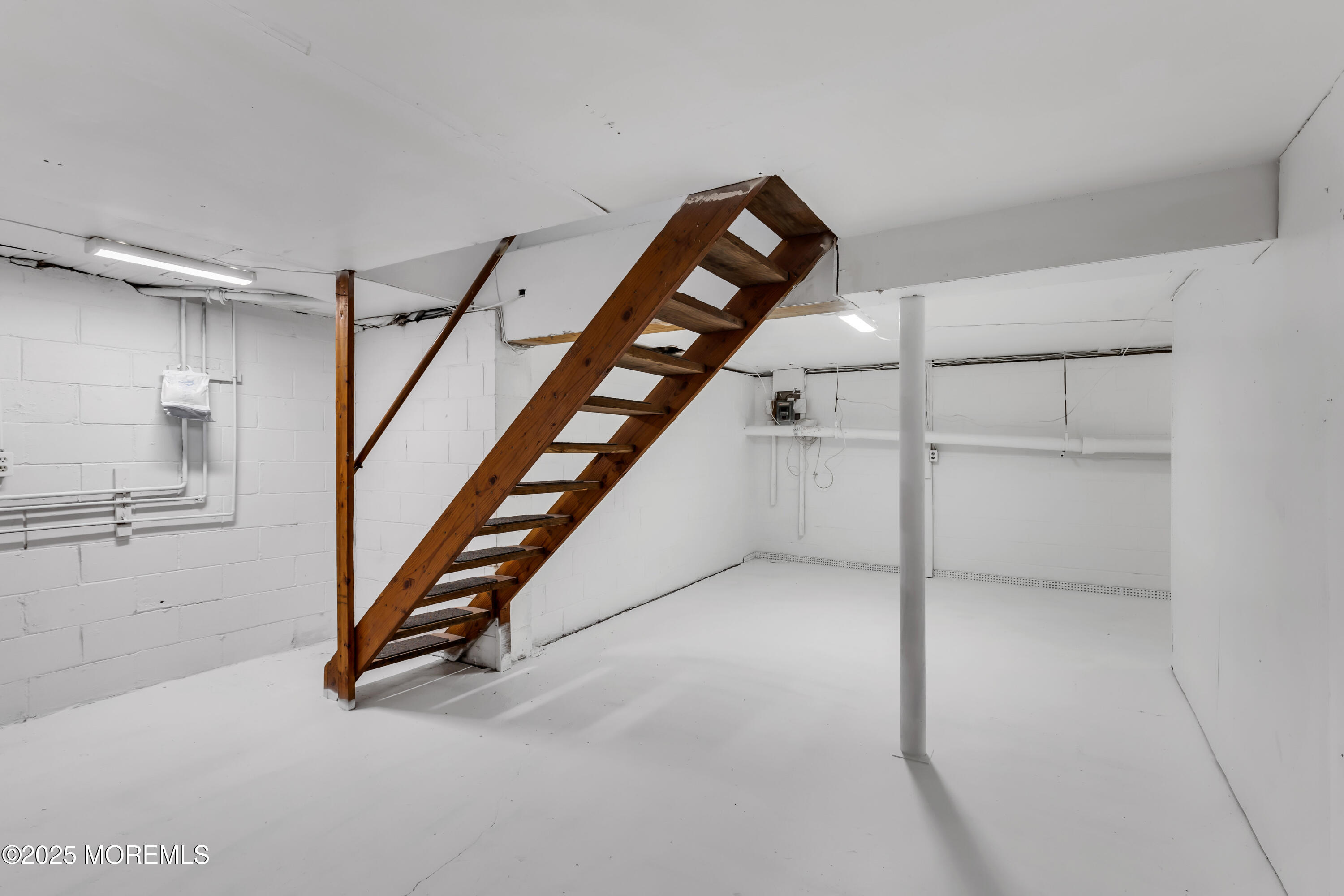 5 Indiana Court, Unit A Matawan, NJ 07747 - Photo 22 of 32 a view of a hallway with staircase