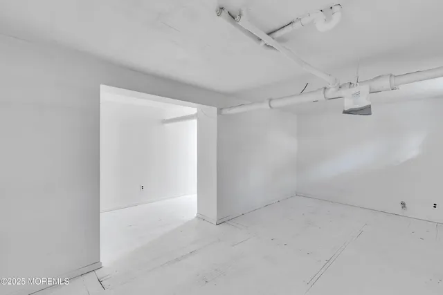an empty room with shelves