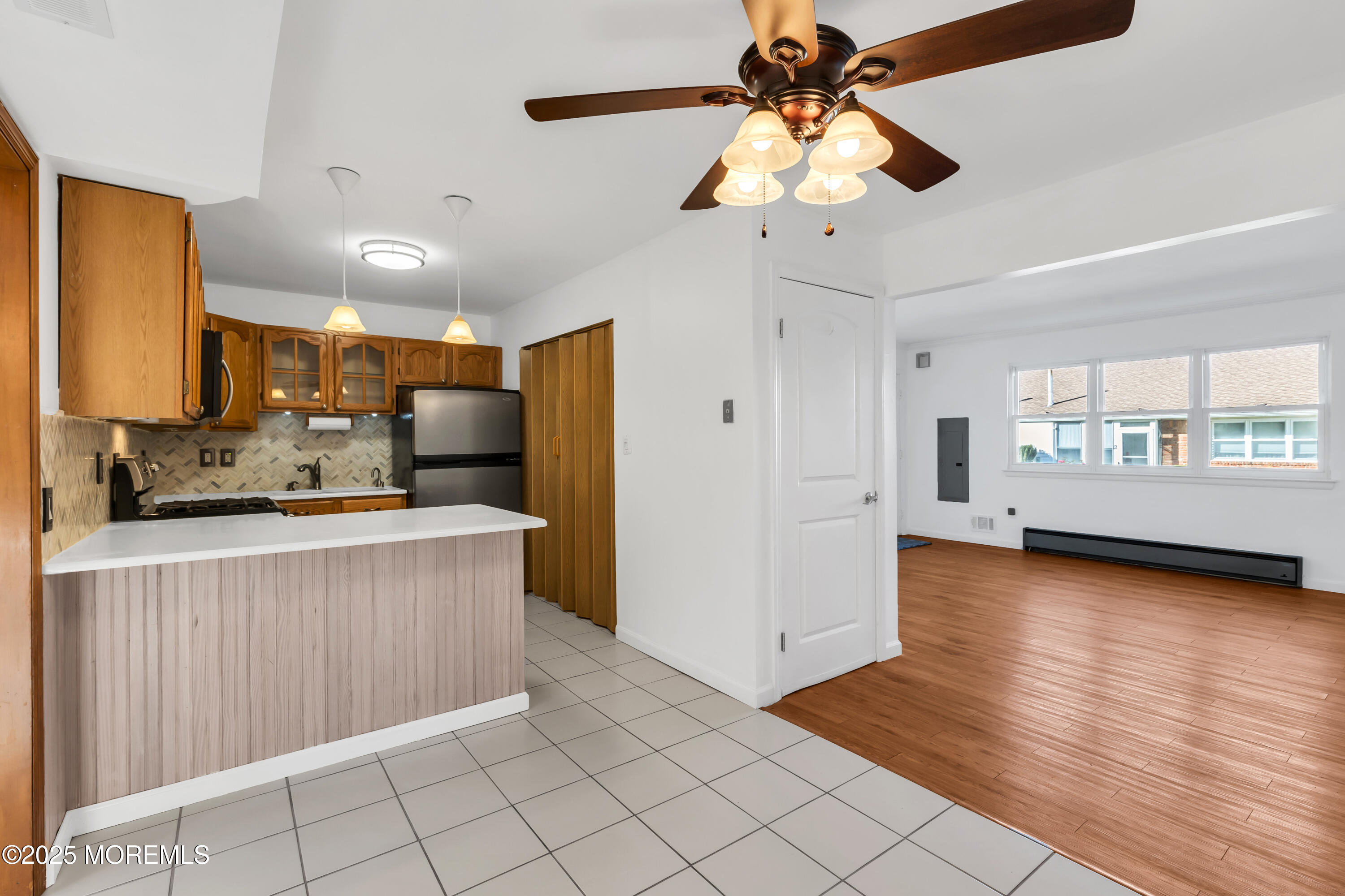 5 Indiana Court, Unit A Matawan, NJ 07747 - Photo 6 of 32 a view of a kitchen with a sink and a window