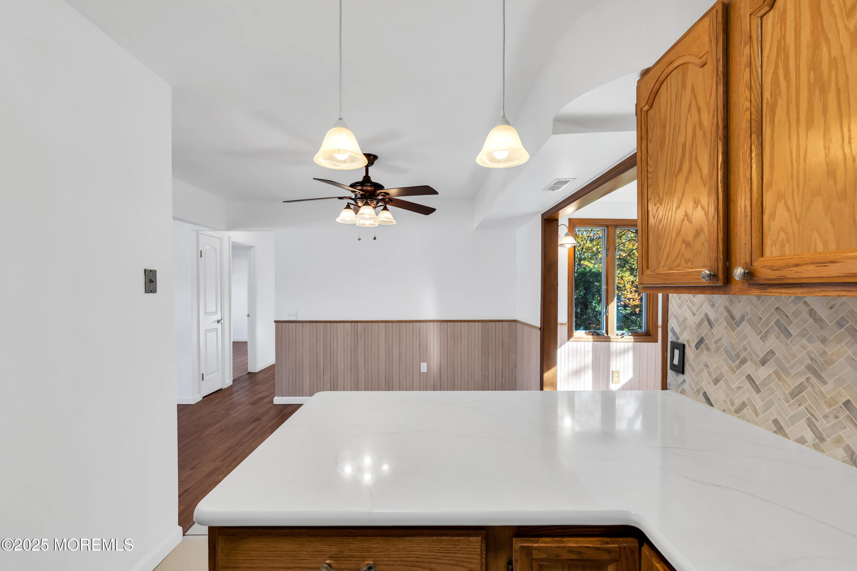 5 Indiana Court, Unit A Matawan, NJ 07747 - Photo 9 of 32 a view of kitchen and living room with a large window