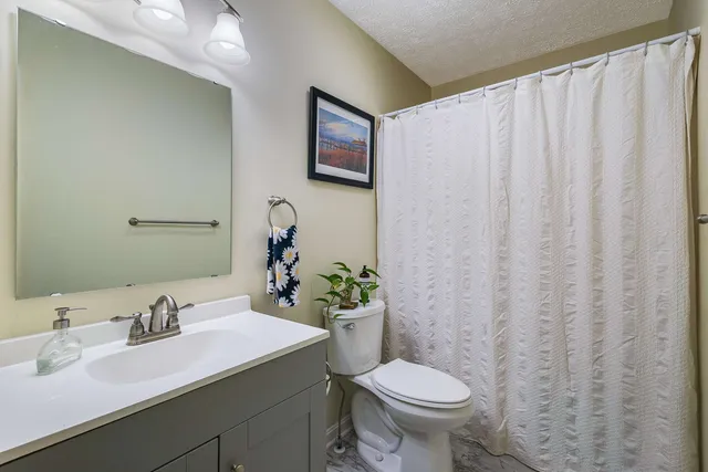 a view of a deck with chairs and a yard