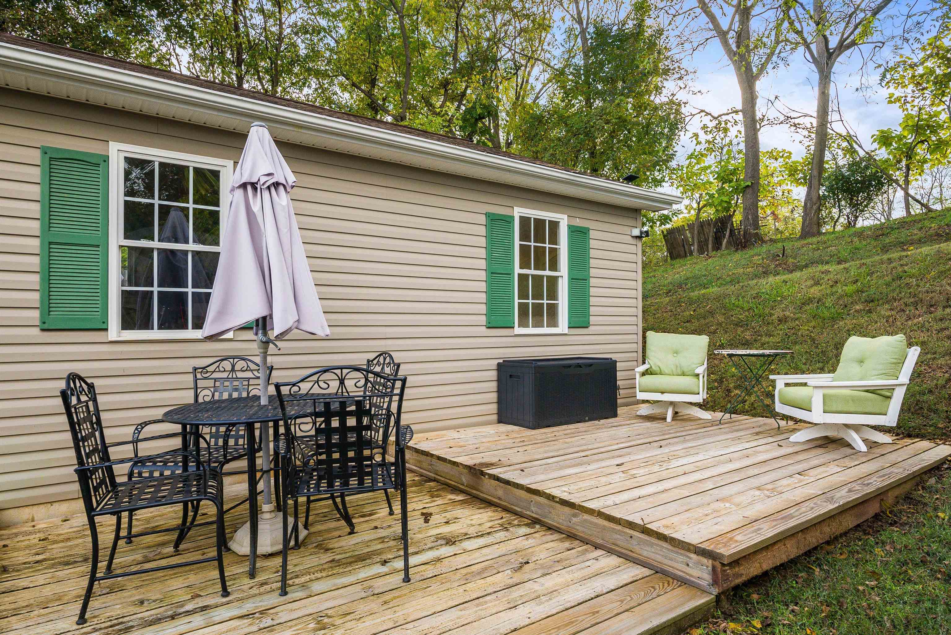 100 Olive Street Staunton, VA 24401 - Photo 2 of 48 a view of a patio with table and chairs with wooden floor and fence