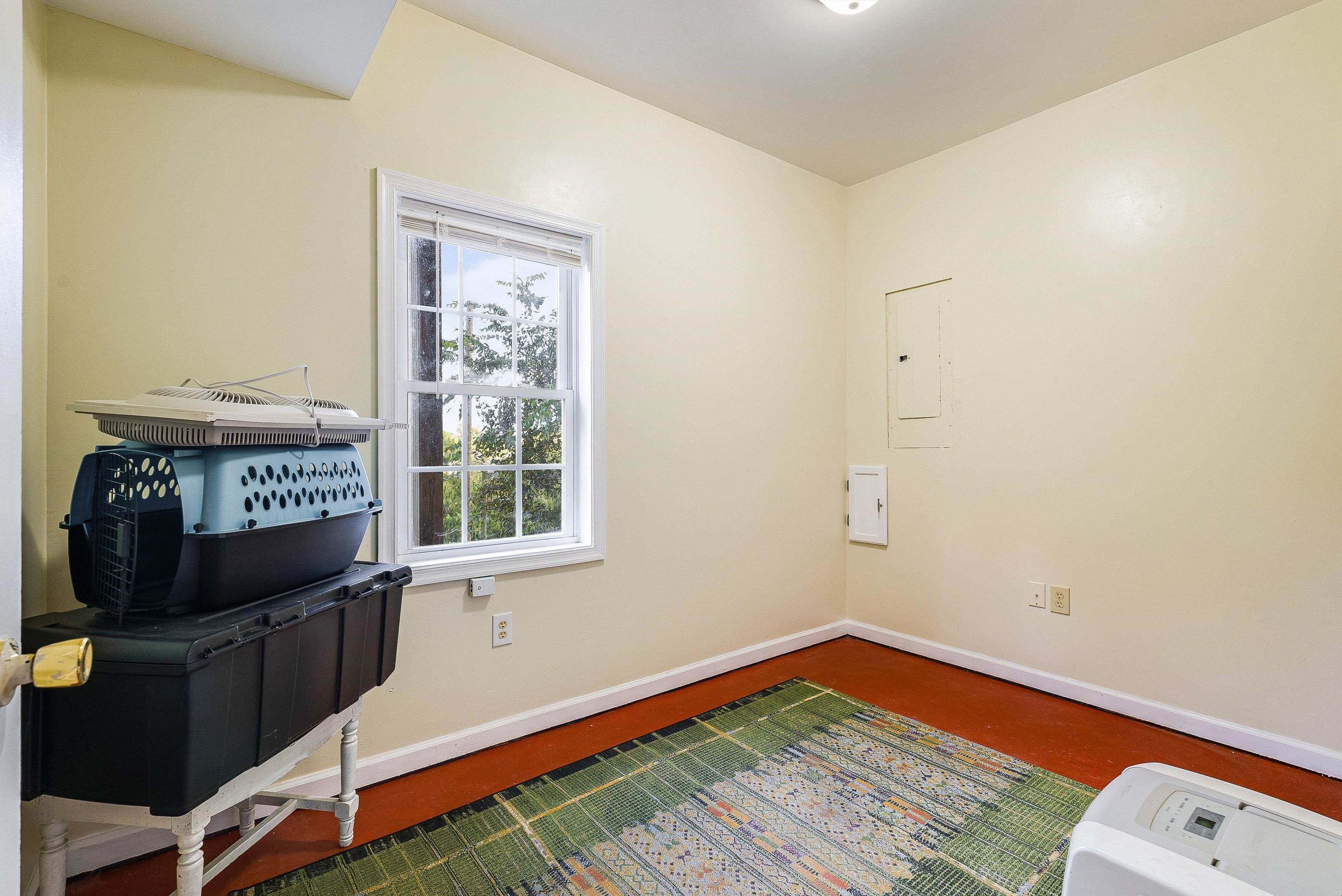 100 Olive Street Staunton, VA 24401 - Photo 27 of 48 a view of an empty room with wooden floor and a window