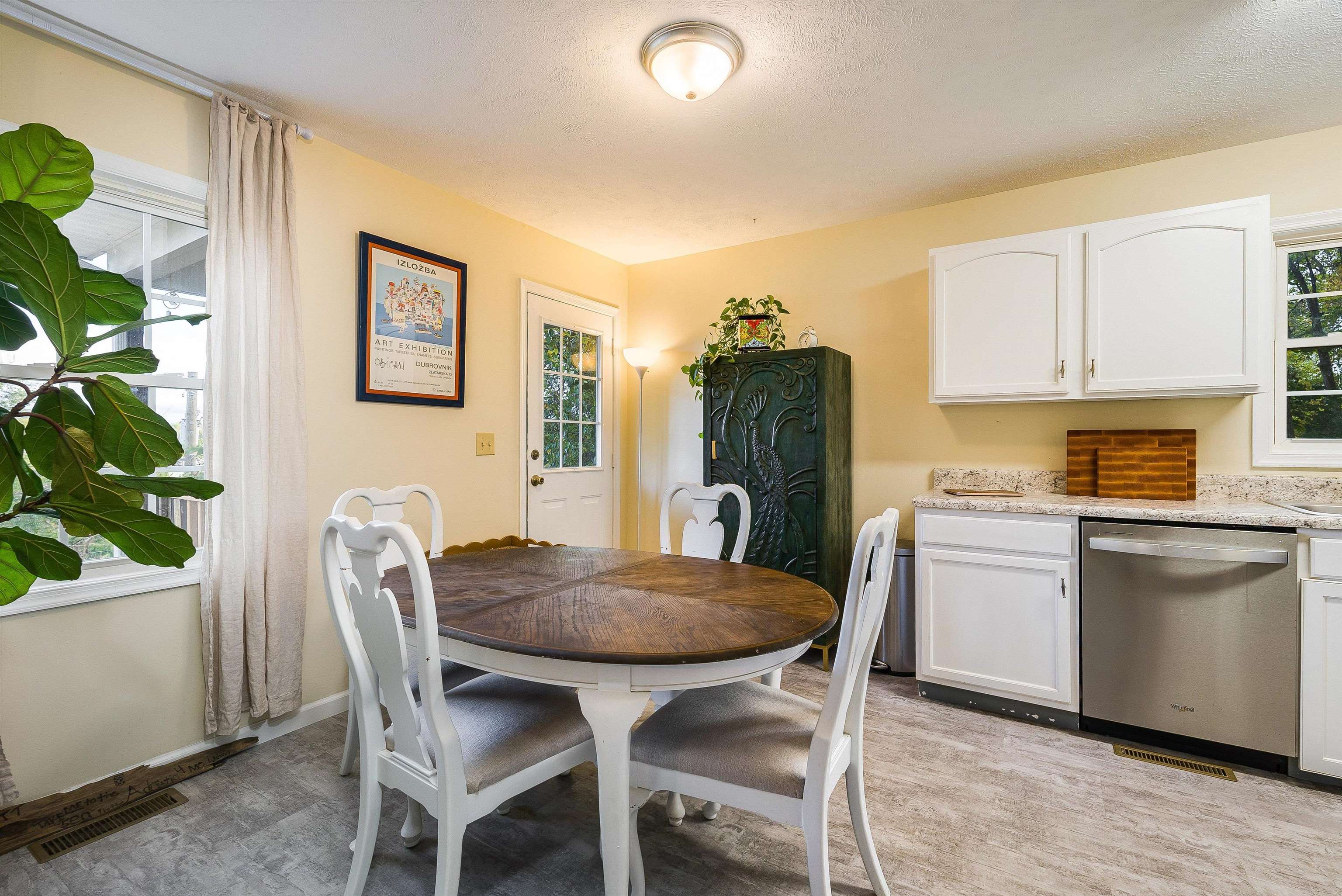 100 Olive Street Staunton, VA 24401 - Photo 8 of 48 a view of a dining room with furniture and a potted plant