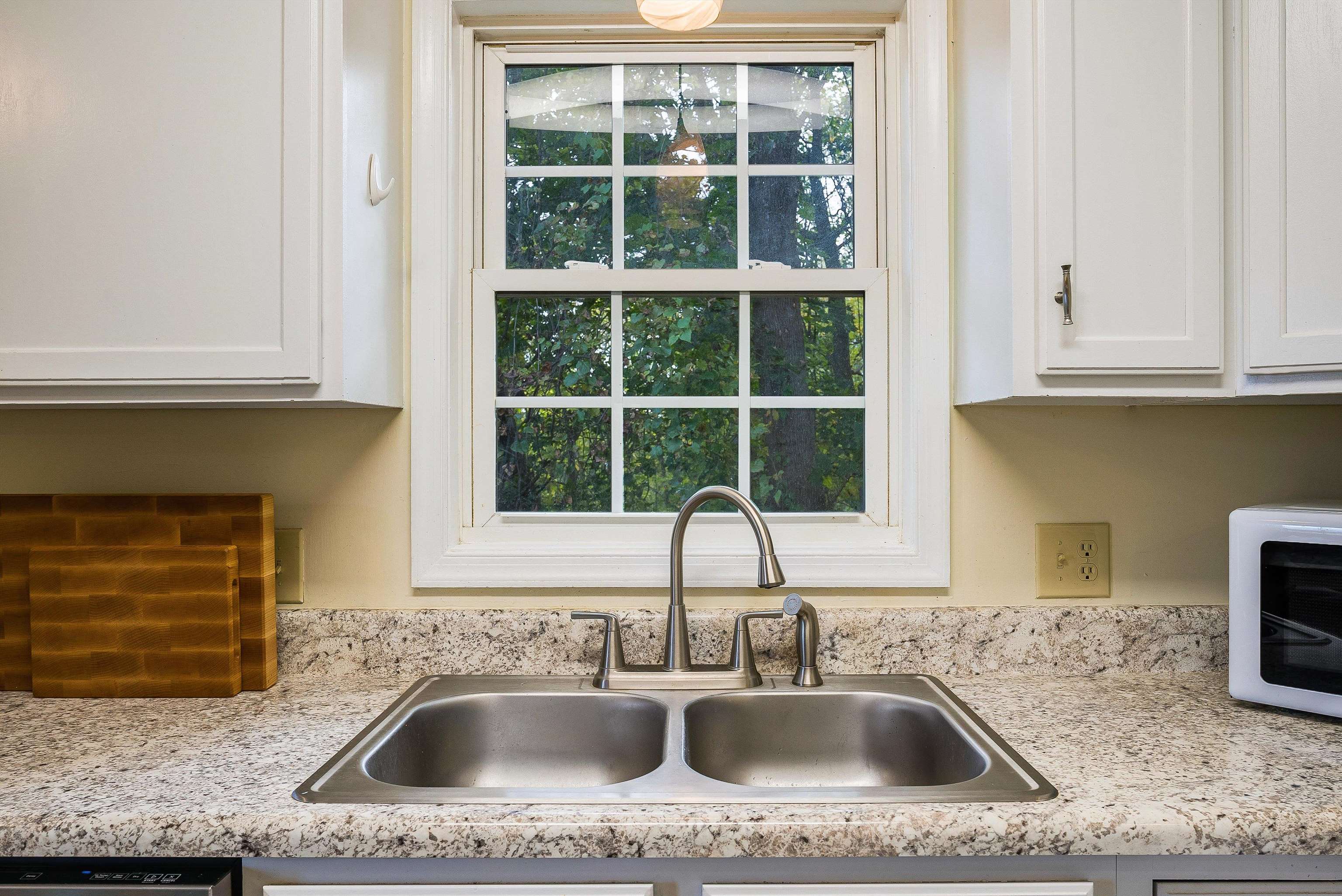 100 Olive Street Staunton, VA 24401 - Photo 10 of 48 a kitchen with granite countertop a sink and a window