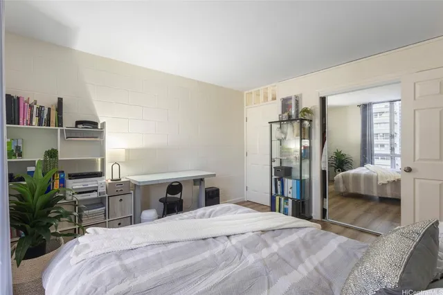 a bedroom with a bed and a view of bedroom