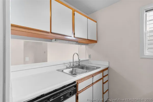 a kitchen with a sink and cabinets