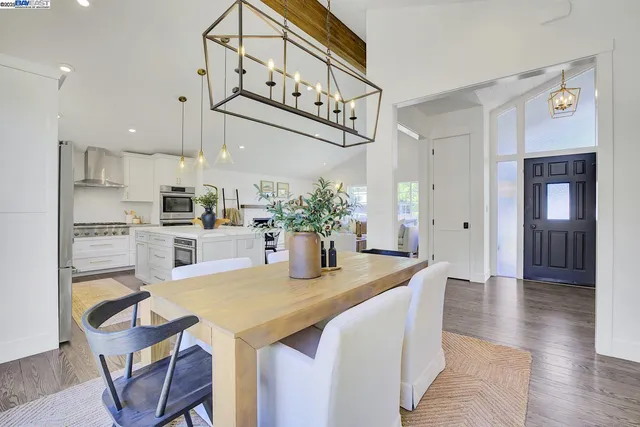 a view of kitchen with cabinets and window