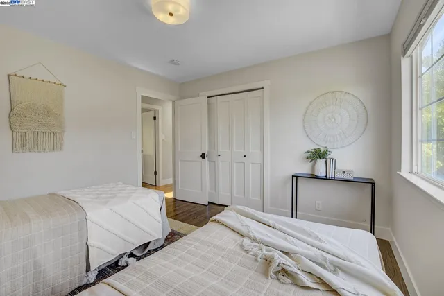 a bathroom with a toilet a sink a mirror a bathtub and vanity