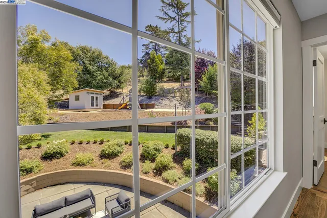 a bedroom with a bed and a night stand