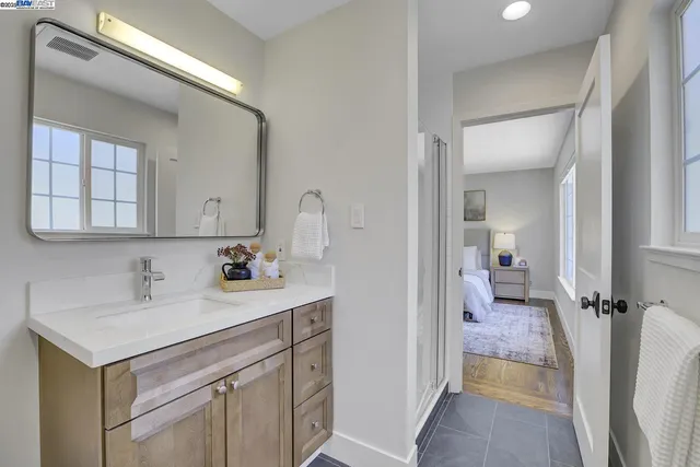 a view of house with backyard and sitting area