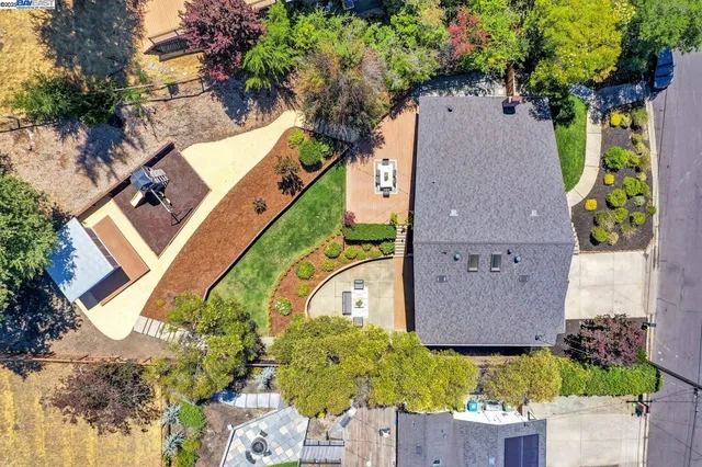 an aerial view of a swimming pool patio and mountain view