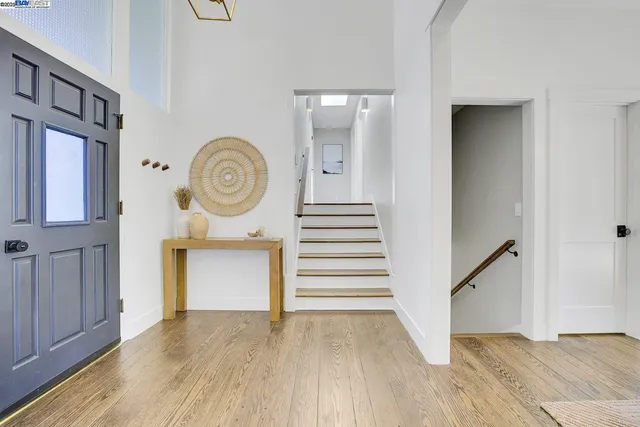 a living room with furniture a fireplace and a table