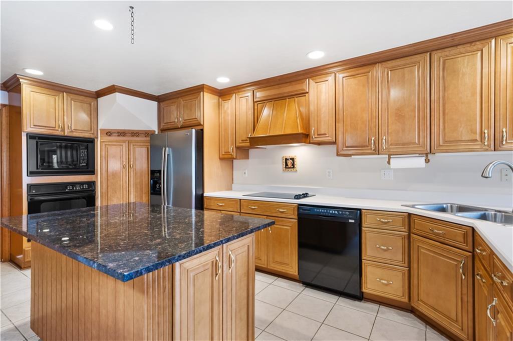 111 Siebert Road Pittsburgh, PA 15237 - Photo 11 of 25 a kitchen with stainless steel appliances granite countertop a sink a stove and a refrigerator