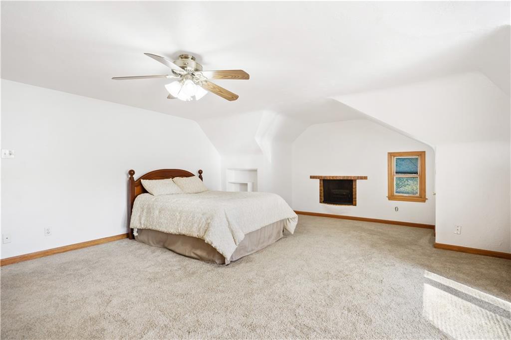 111 Siebert Road Pittsburgh, PA 15237 - Photo 15 of 25 a bedroom with a bed and a ceiling fan