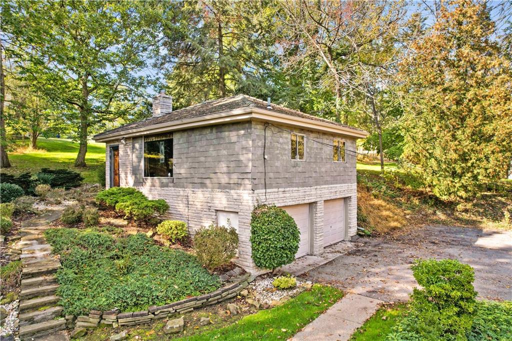 111 Siebert Road Pittsburgh, PA 15237 - Photo 3 of 25 a front view of a house with garden