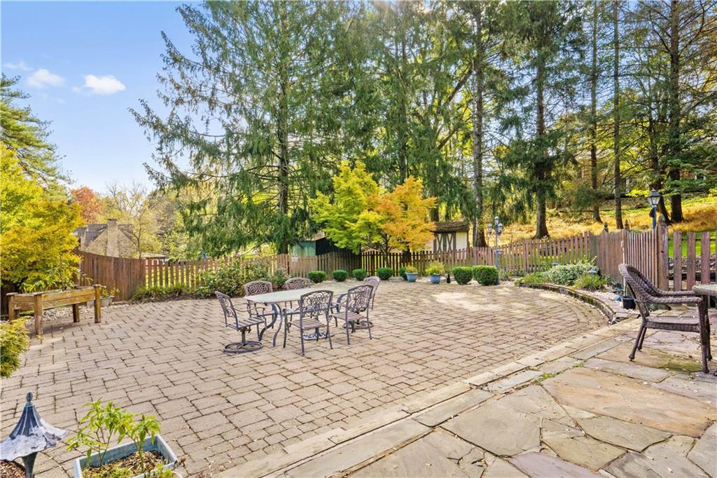 111 Siebert Road Pittsburgh, PA 15237 - Photo 23 of 25 a view of a patio with a table and chairs and potted plants