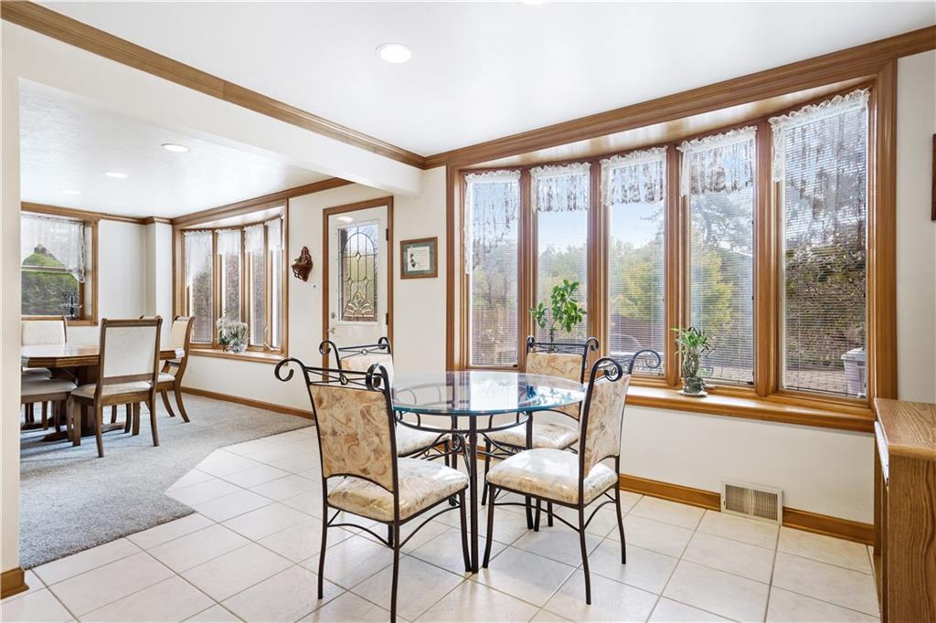 111 Siebert Road Pittsburgh, PA 15237 - Photo 8 of 25 a dining room with furniture and large windows