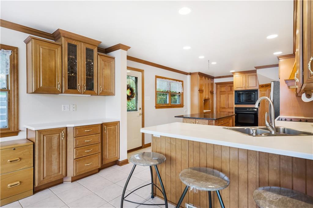 111 Siebert Road Pittsburgh, PA 15237 - Photo 10 of 25 a living room with stainless steel appliances kitchen island granite countertop furniture and a kitchen view