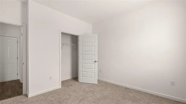 a bathroom with a bathtub shower sink vanity and toilet
