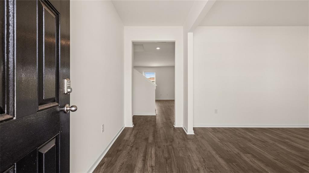 212 Cattle Drive Perry, GA 31069 - Photo 2 of 40 a view of a hallway with wooden floor and a bathroom