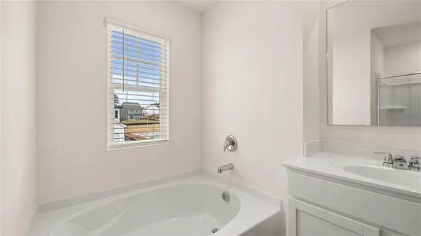 a bathroom that has a glass shower door