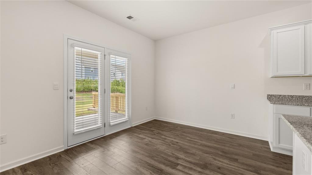 212 Cattle Drive Perry, GA 31069 - Photo 10 of 40 wooden floor in an empty room with a window