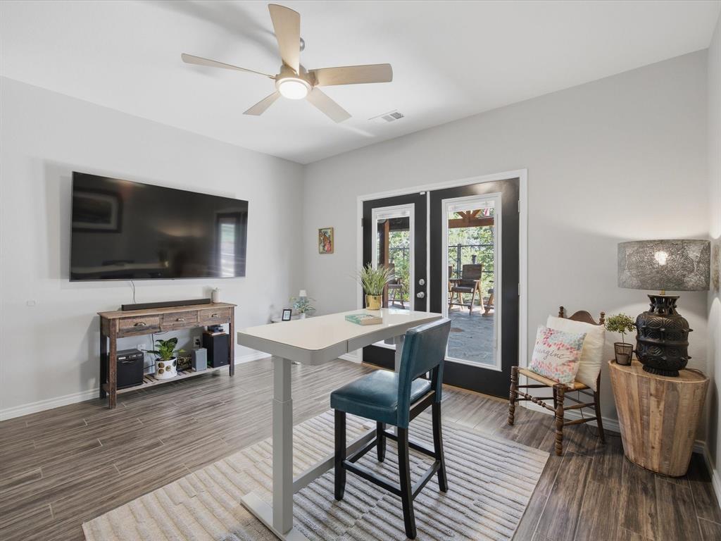 117 Ranchview Court Bowie, TX 76230 - Photo 23 of 40 a living room with furniture and a flat screen tv