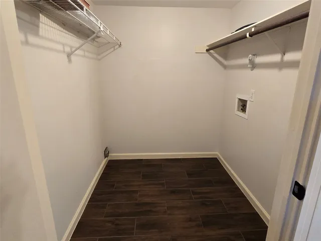a bathroom with a granite countertop sink toilet and a mirror