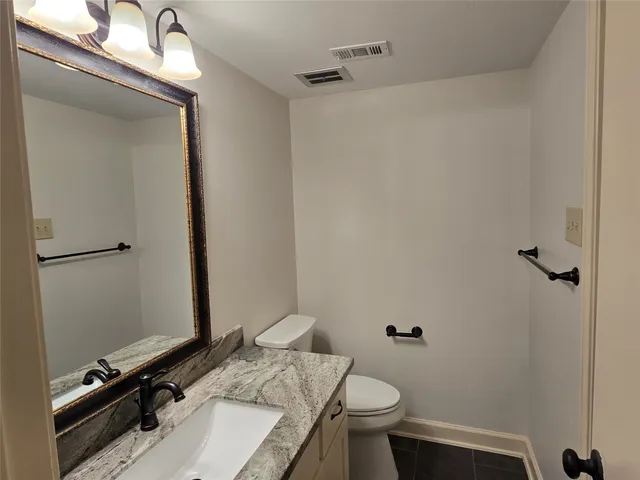 a bathroom with a tub a sink and a shower