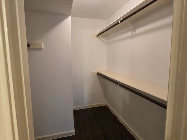 a view of a porch with a table and chairs