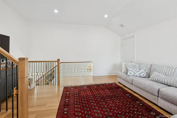 a living room with furniture and a rug
