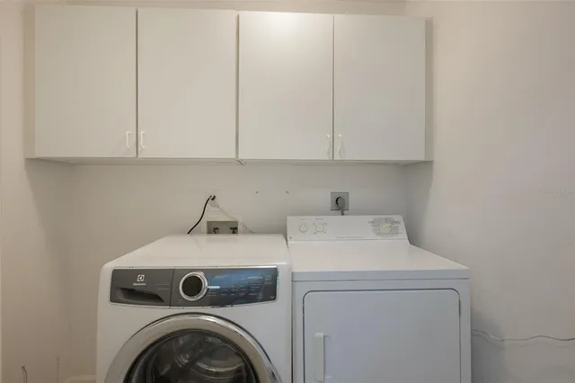 a view of a hallway with wooden shelves