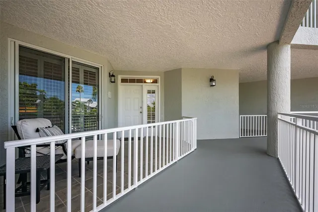a view of a two chairs in the balcony