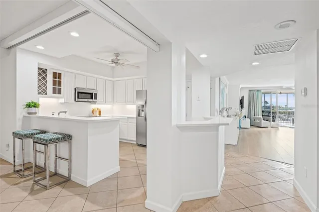a kitchen with a sink cabinets and window