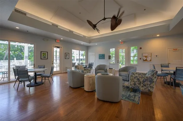 a view of a dining room with furniture window and wooden floor