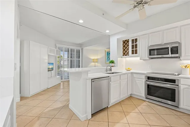 a kitchen with cabinets and window