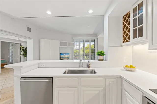 a kitchen with a sink and cabinets