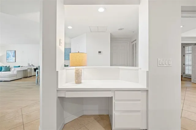 a bathroom with a bathtub sink and mirror
