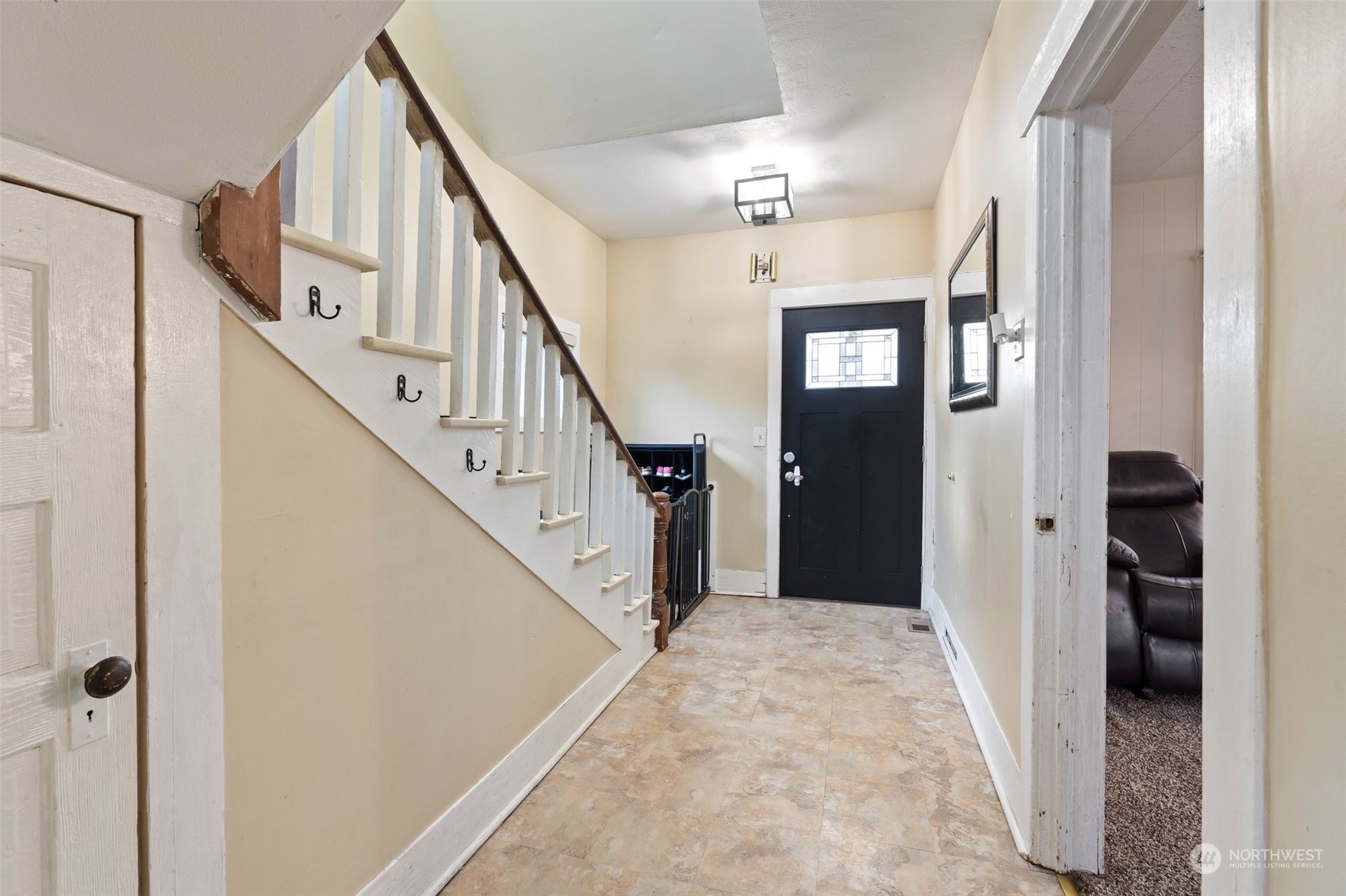 73 East Main Street Chehalis, WA 98532 - Photo 13 of 35 a view of a hallway with wooden floor and staircase