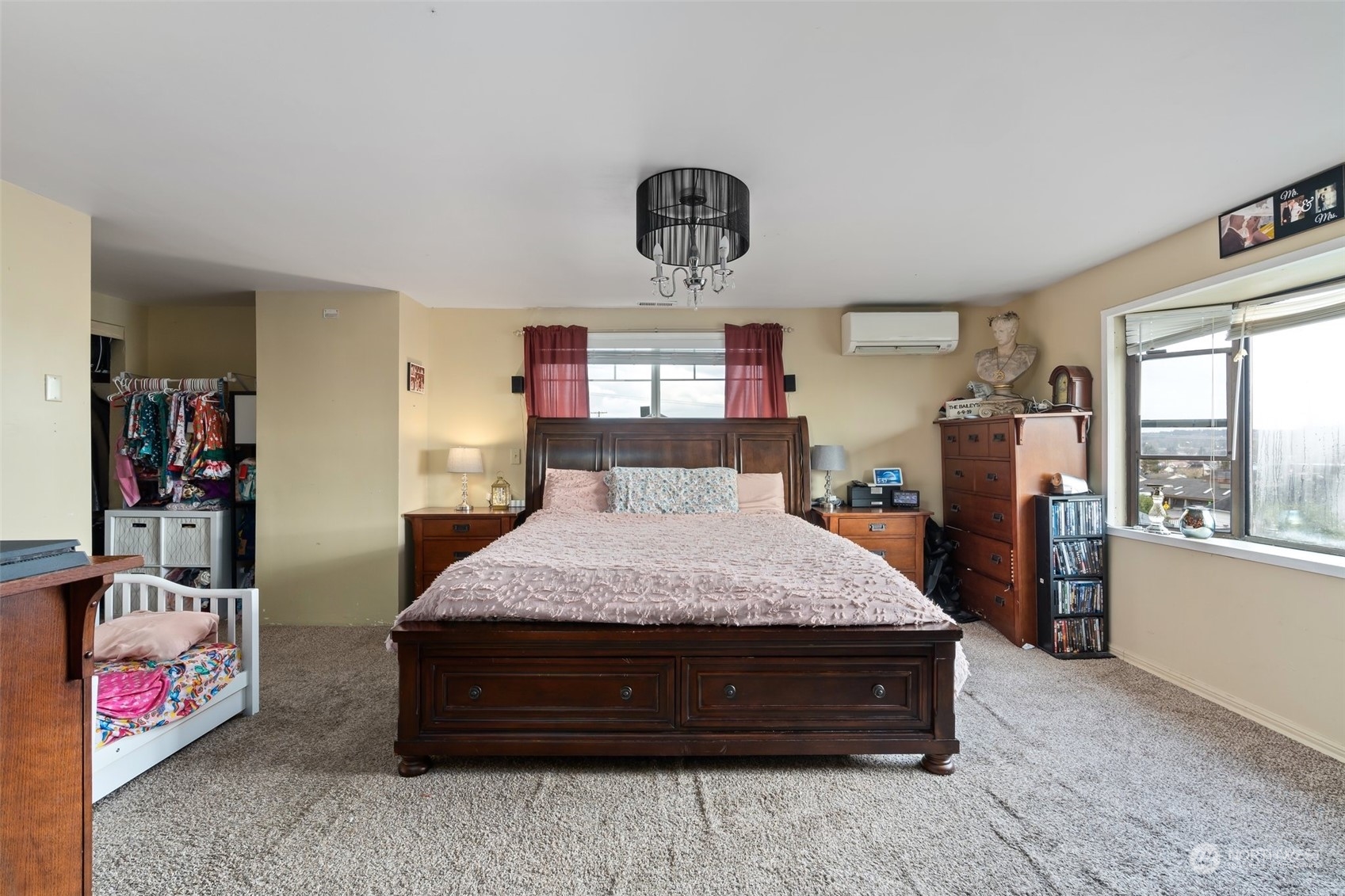 73 East Main Street Chehalis, WA 98532 - Photo 14 of 35 a spacious bedroom with a bed and window